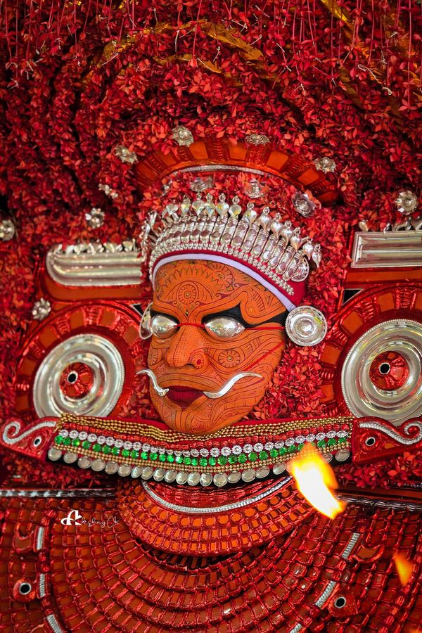 Side view of the Bhagavathi with a lit torch